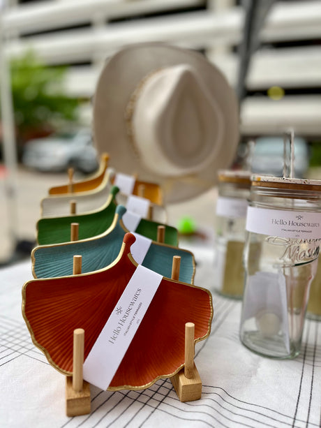 professional photo of a gold rim ginkgo jewelry dish